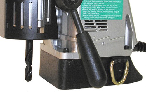 Jancy Magnetic Drill #06920 Close up of bottom with drill bit in frame that can drill 2 inches deep and is 1 3/8 inches big